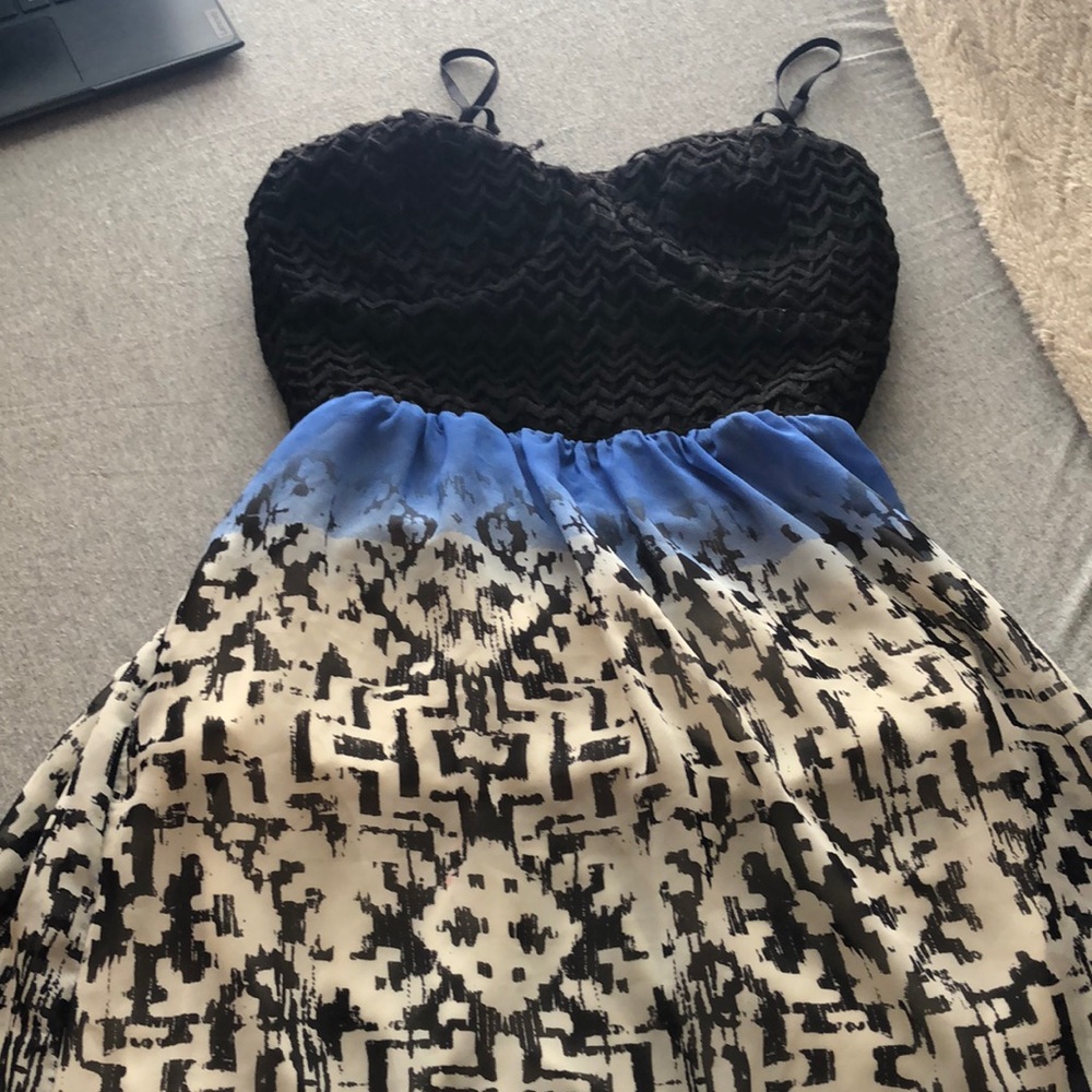 Cut open in the back super cute long feathered dress one of my favorites